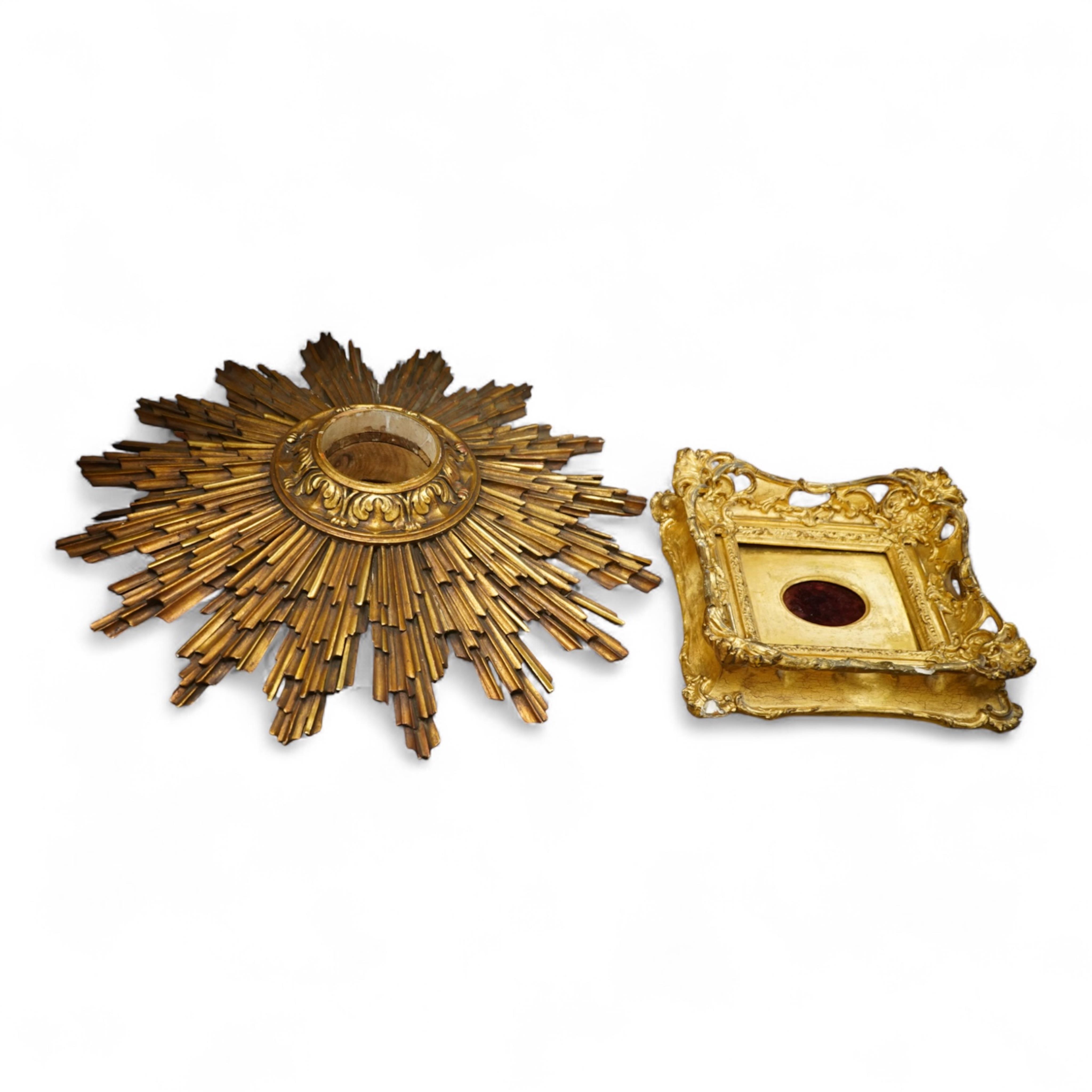 A gilt decorated sun burst clock frame, 63cm wide and a mid 19th century ornate gilt miniature frame
